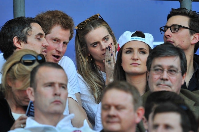 Britain's Prince Harry (2-L) and British socialite Cressida Bonas (3-L) watch the match during the Six Nations International rugby Union match between England and Wales at Twickenham, West London on March 9, 2014. Britain's Prince Harry (2-L) and British socialite Cressida Bonas (3-L) watch the match during the Six Nations International rugby Union match between England and Wales at Twickenham, West London on March 9, 2014.