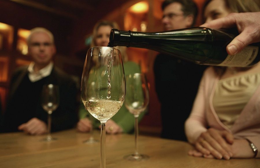 A glas is filled with Riesling wine A glas is filled with Riesling wine