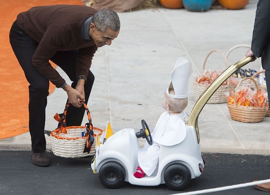 Obama with a kid in cute costume