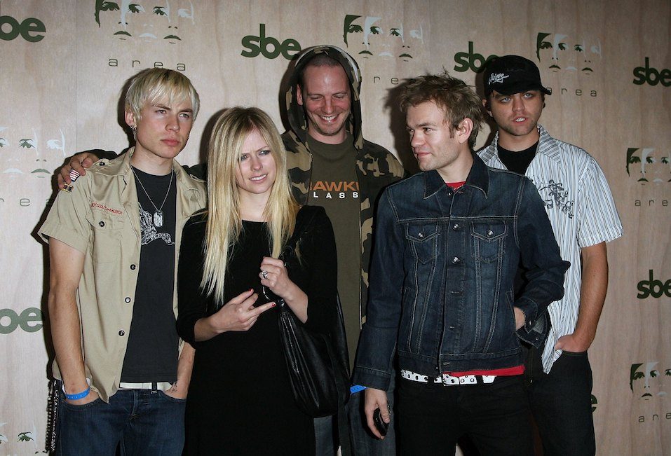 Singers Avril Lavigne and Deryck Whibley arrive at the AREA Nightclub Grand Opening Singers Avril Lavigne and Deryck Whibley arrive at the AREA Nightclub Grand Opening