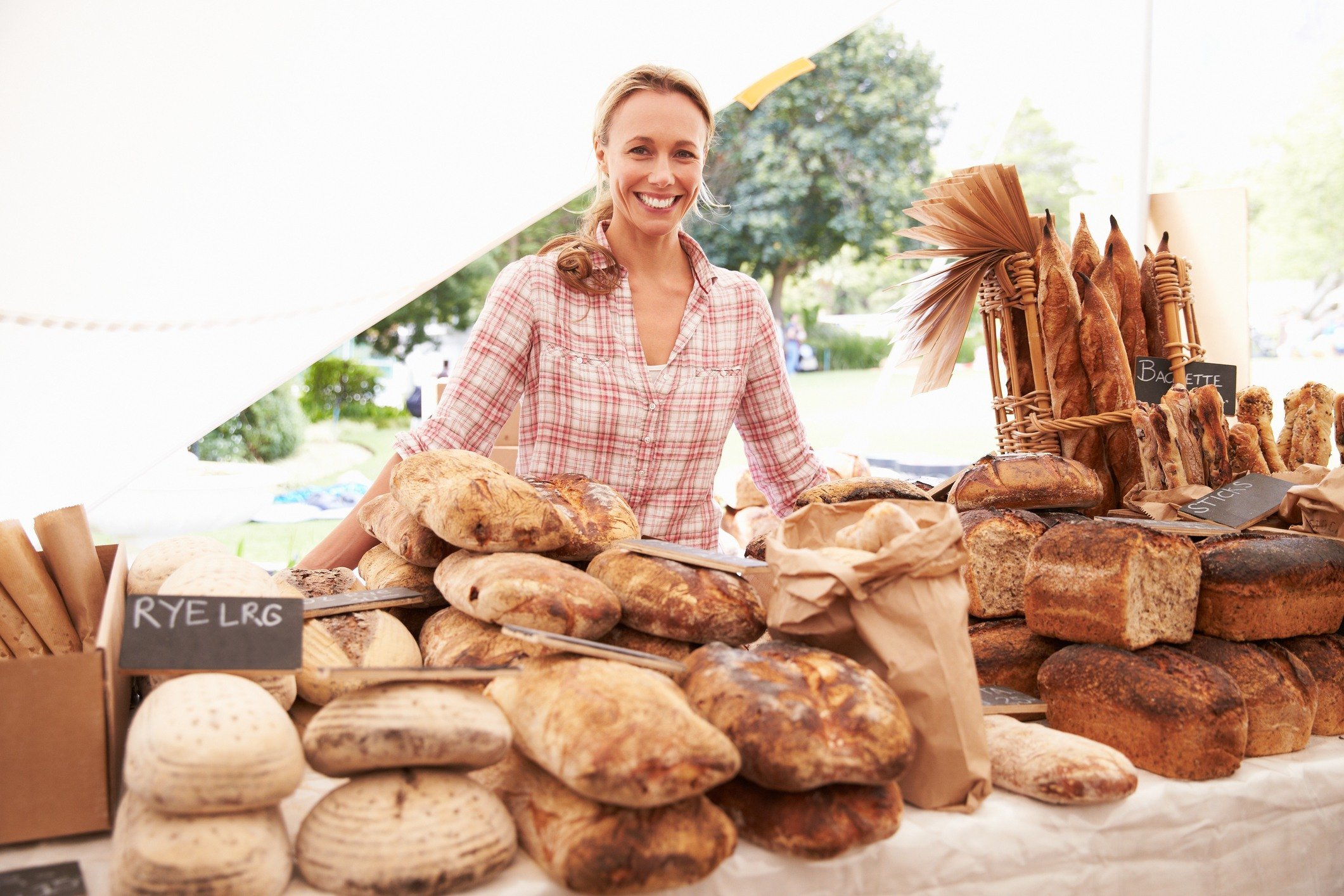 Female Bakery Stall Holder At Farmers Fresh Food Market