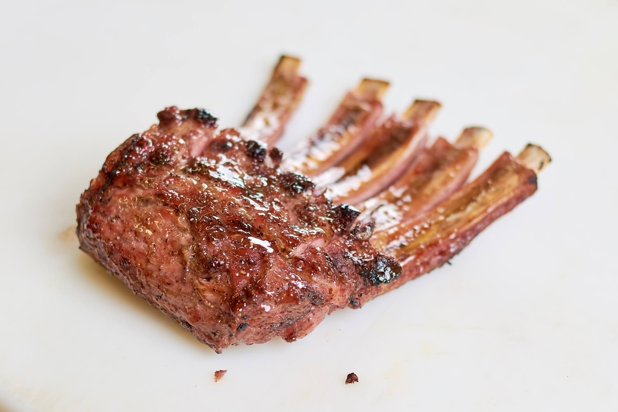 Grilled mutton ribs on white background.