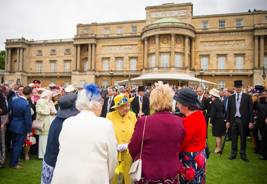 Britain's Queen Elizabeth II greets guests, after observing a minute's silence at the start of a Special Garden Party at Buckingham Palace