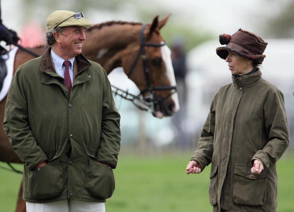Princess Anne, Princess Royal jokes with her ex-husband Mark Phillips before the show jumping