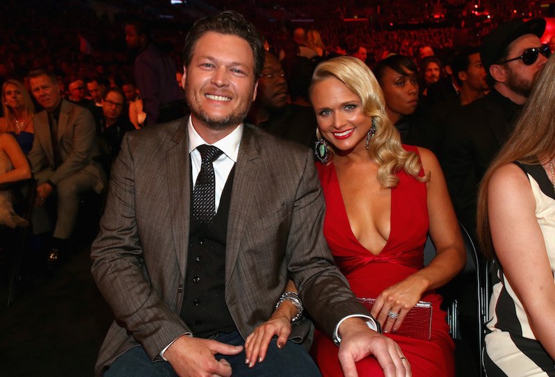 Blake Shelton and Miranda Lambert sitting together at an awards show. Blake Shelton and Miranda Lambert sitting together at an awards show.