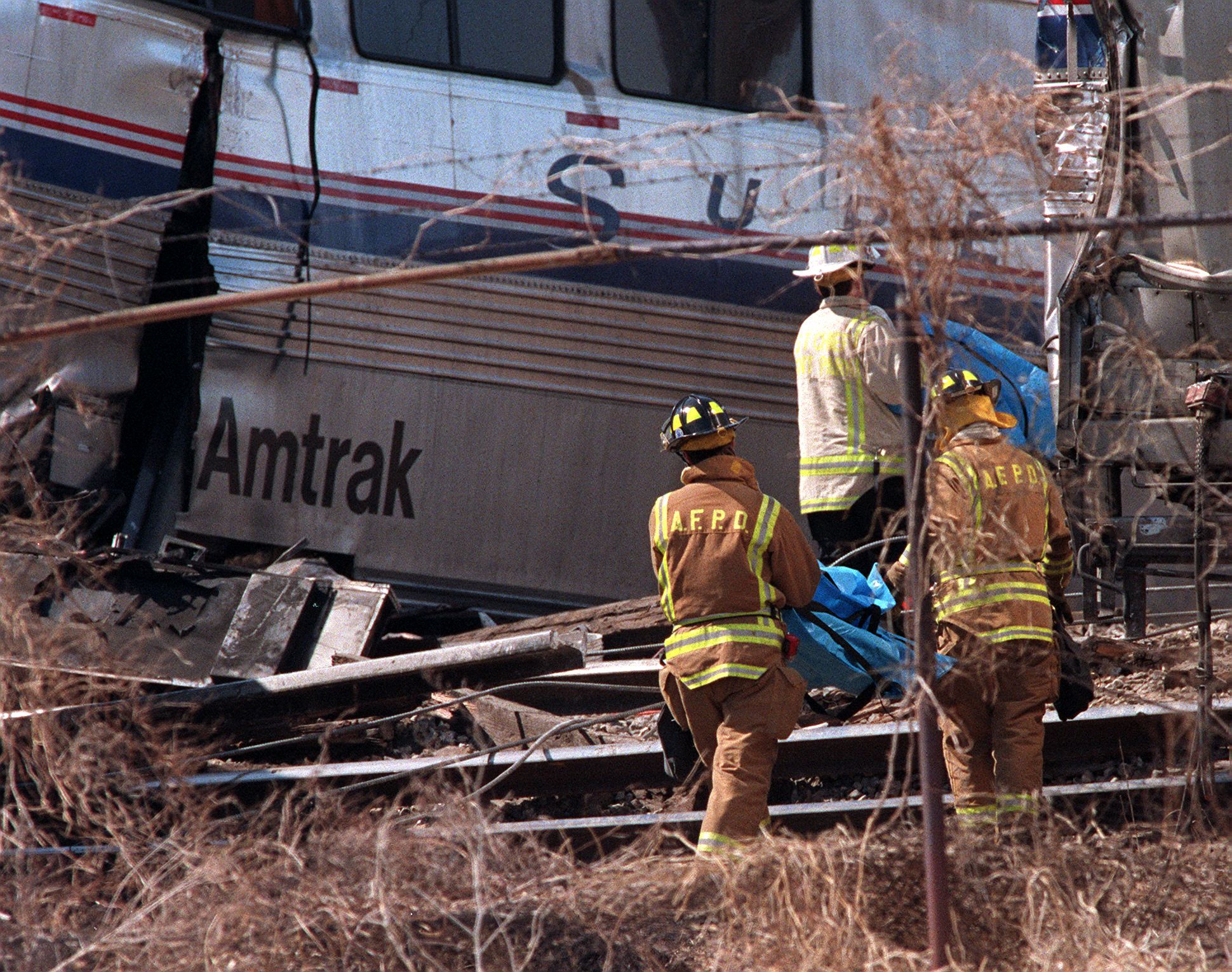 Fire and rescue workers remove two more bodies fro