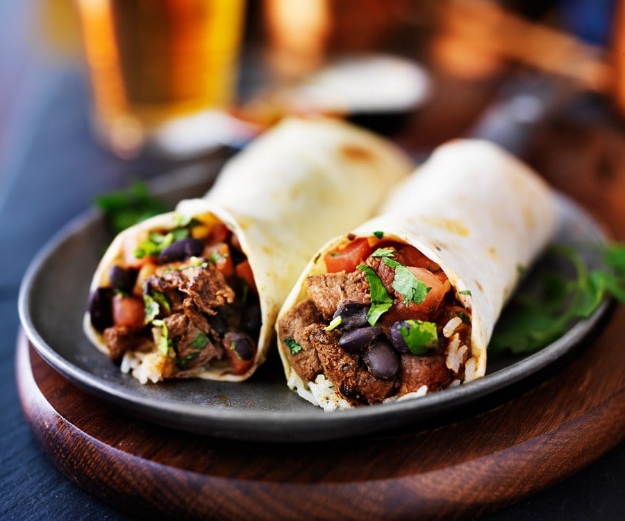 two mexican steak burritos with beer two mexican steak burritos with beer