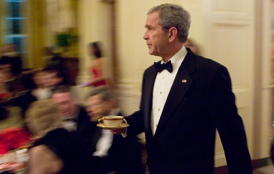 US President George W. Bush with a cup