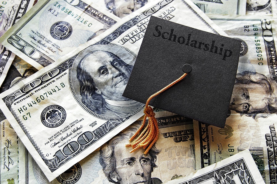 Graduation cap with dollar bills Graduation cap with dollar bills