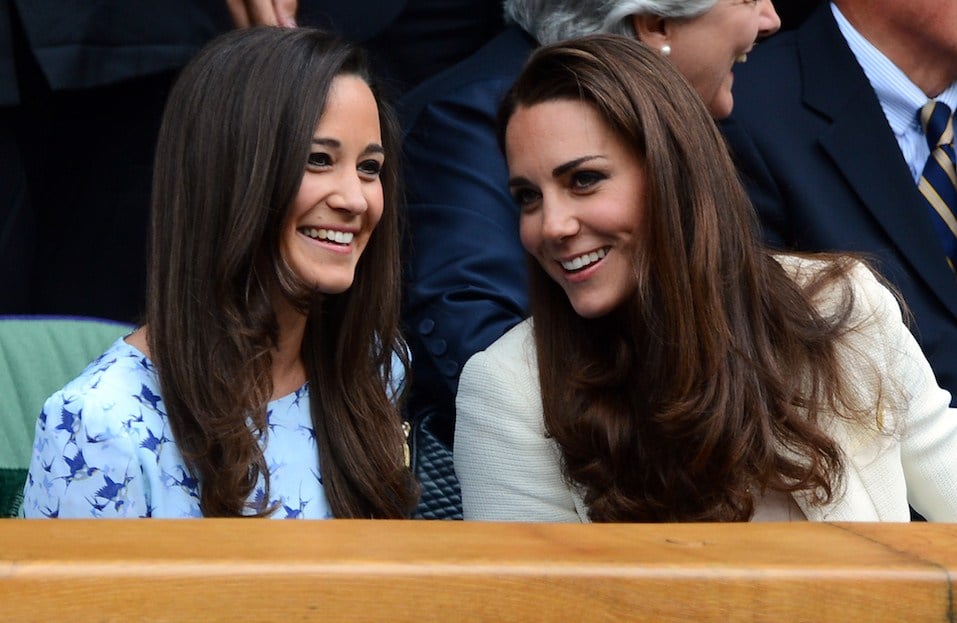 Catherine, Duchess of Cambridge and her sister Pippa Middleton talk in the Royal Box