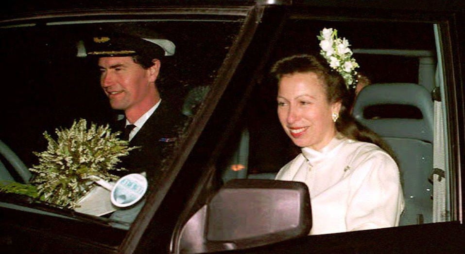 Commander Tim Laurence and Britain's Princess Anne are seen in their car after their wedding at Crathie Church Commander Tim Laurence and Britain's Princess Anne are seen in their car after their wedding at Crathie Church