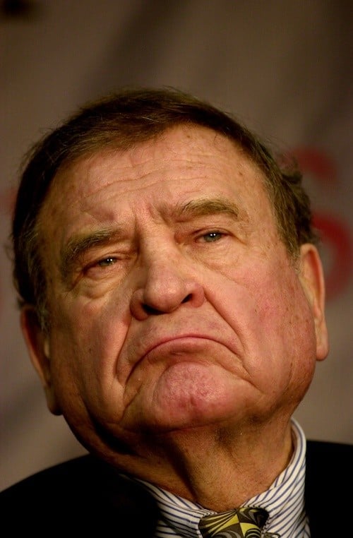 Dan Rostenkowsi wearing a suit and tie as he frowns. Dan Rostenkowsi wearing a suit and tie as he frowns.