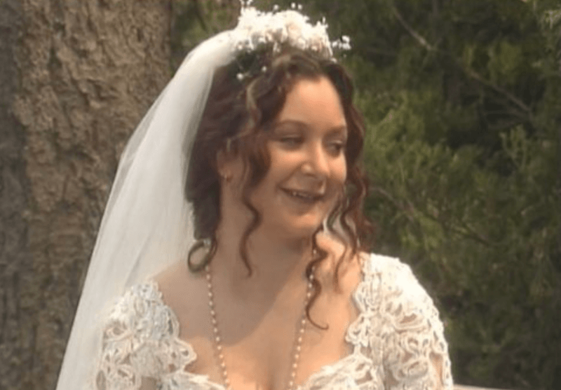 Darlene smiling while in her wedding dress. Darlene smiling while in her wedding dress.