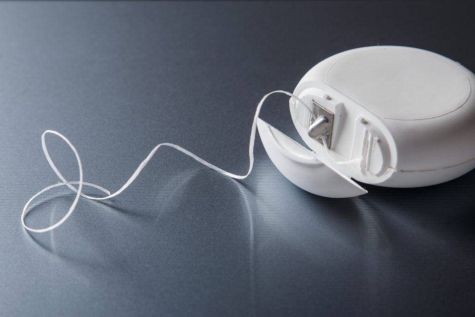 Container with dental floss