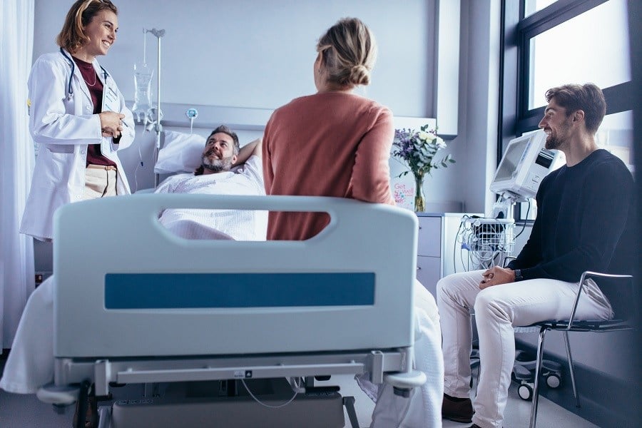 doctor attendants and Patient lying on bed doctor attendants and Patient lying on bed