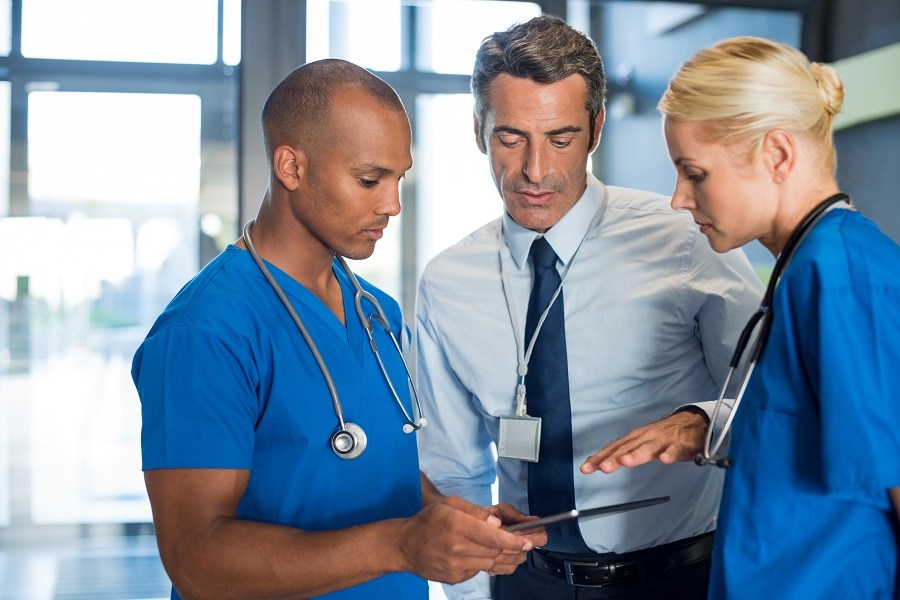 Doctor talking to staff Doctor talking to staff