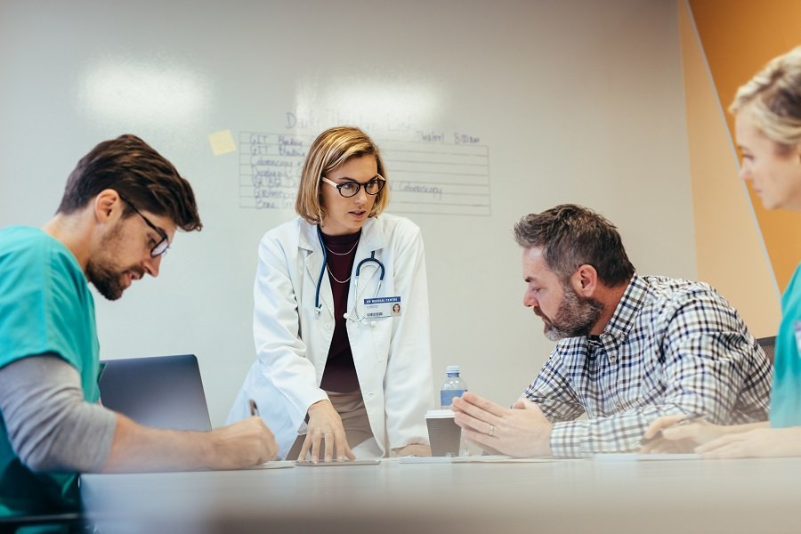 Doctor explaining reports Doctor explaining reports