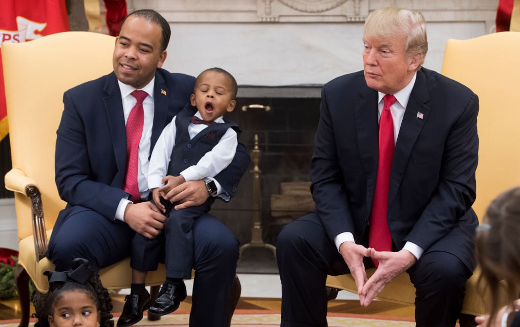 Donald Trump with a yawning child
