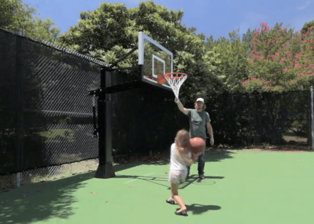 Emmie and Chip playing basketball