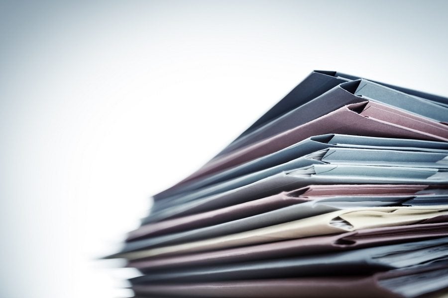 Pile of business document files Pile of business document files