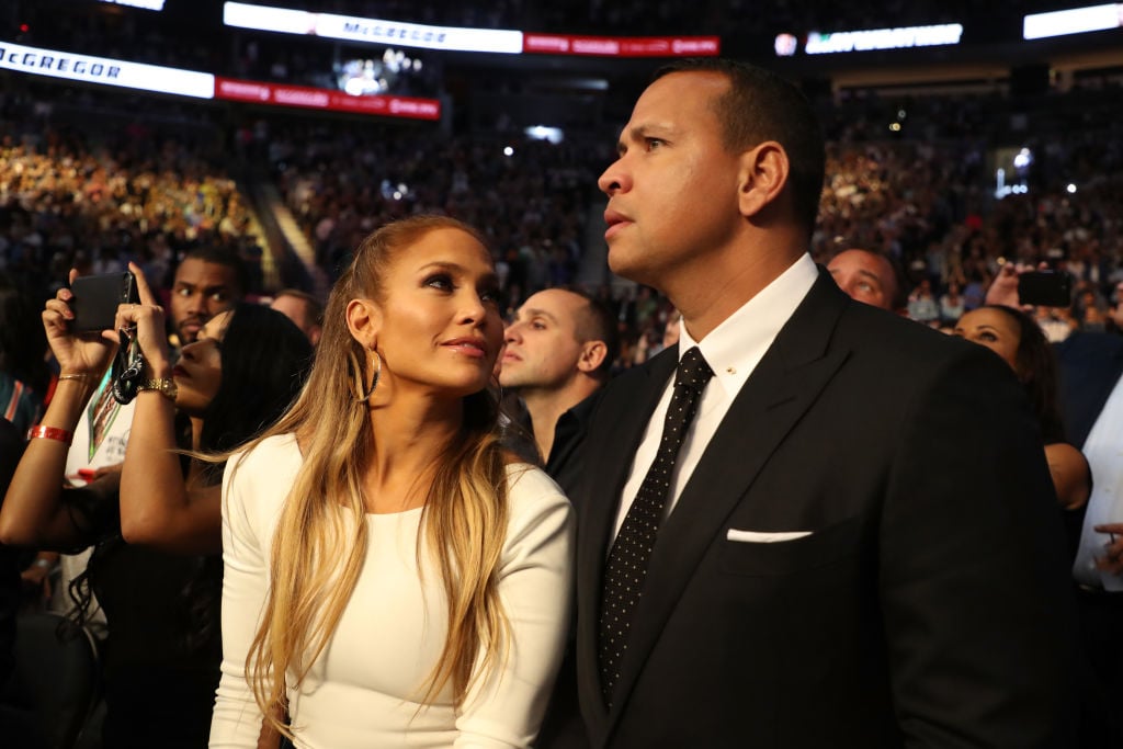 Actress Jennifer Lopez and former MLB player Alex Rodriguez attend the super welterweight boxing match