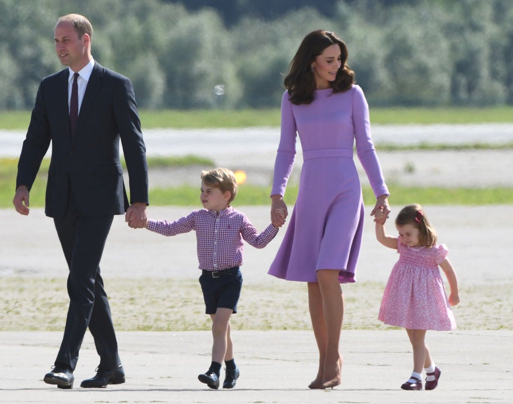 Britain's Prince William, Duke of Cambridge and his wife Kate, the Duchess of Cambridge, and their children Prince George and Princess Charlotte on the tarmac of the Airbus compound in Hamburg