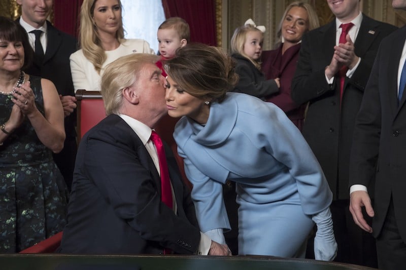 President Donald Trump kisses his wife Melania Trump