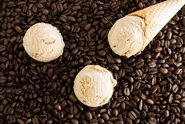 Scoops of Coffee Ice Cream and Cone on Coffee Beans