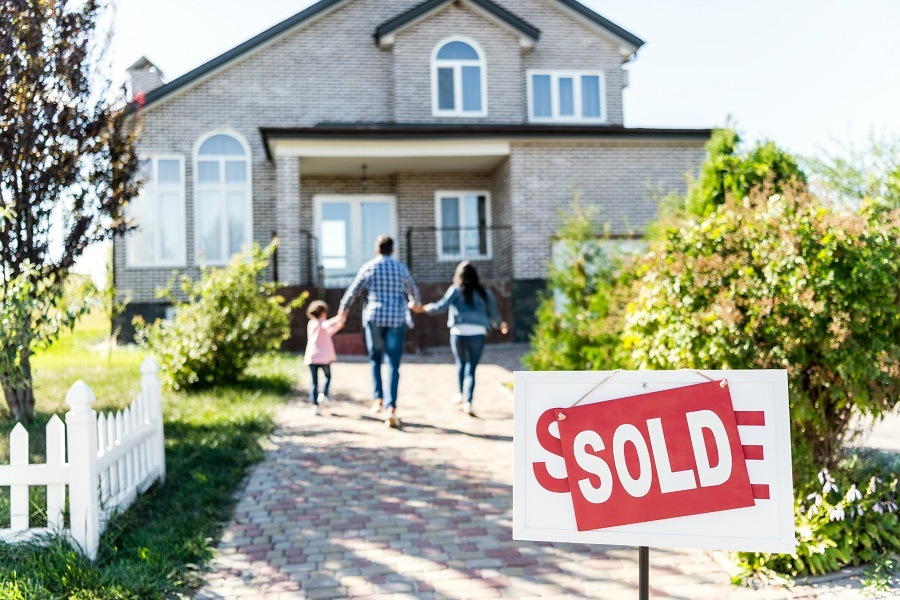 Family moving in with sold board Family moving in with sold board