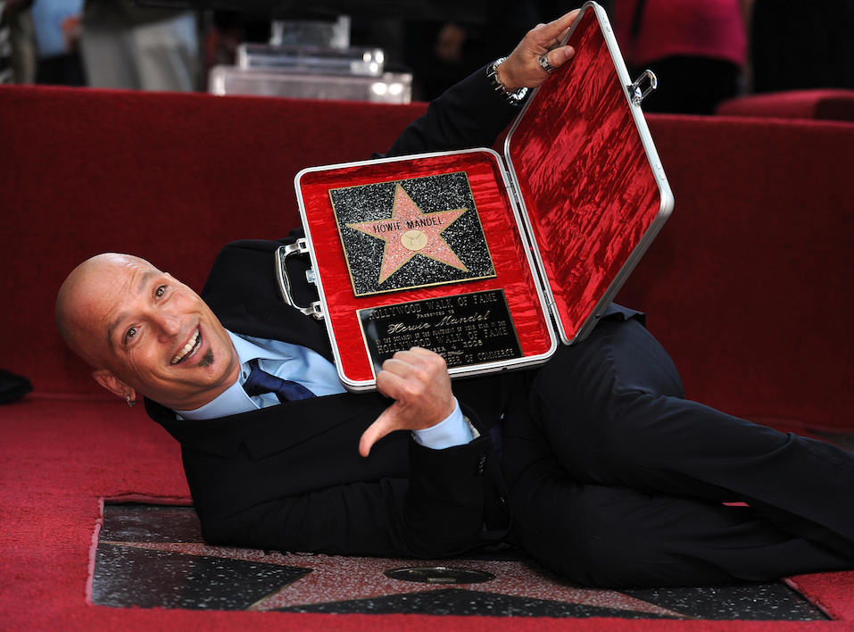 Howie Mandel, host of TV show "Deal or No Deal" on NBC poses after he received a star on the Hollywood Walk of Fame