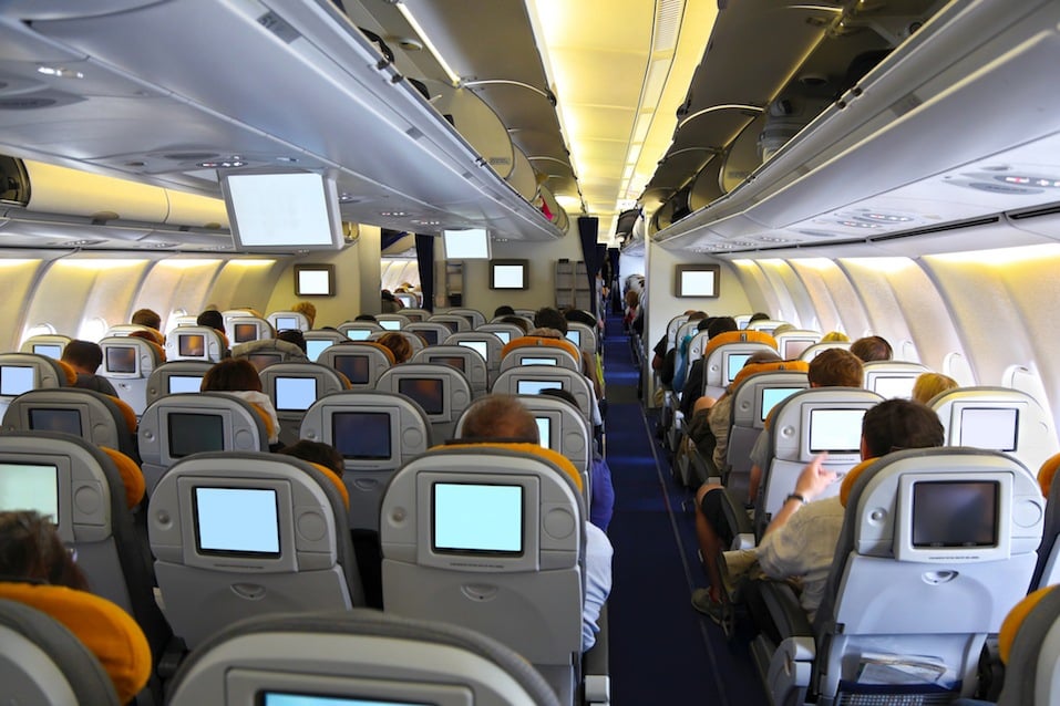 Passengers watching movie in the airplane over the sea