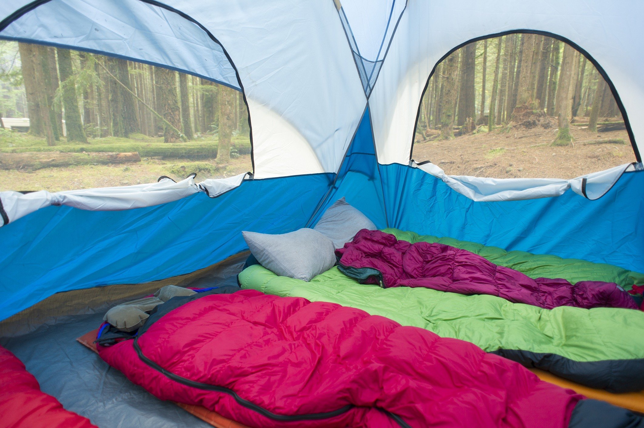 The interior of a tent with multiple sleeping bags