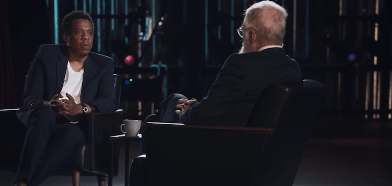 Jay-Z sits and talks to David Letterman. 