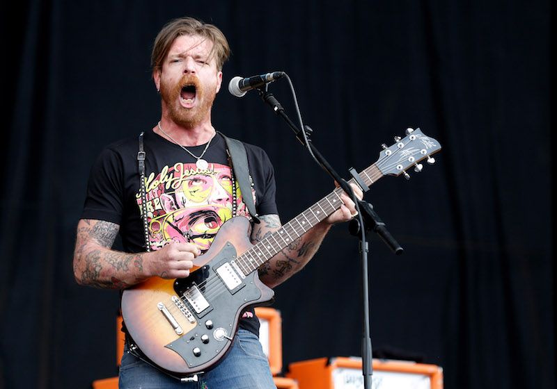 Jesse Hughes performing while in concert. 