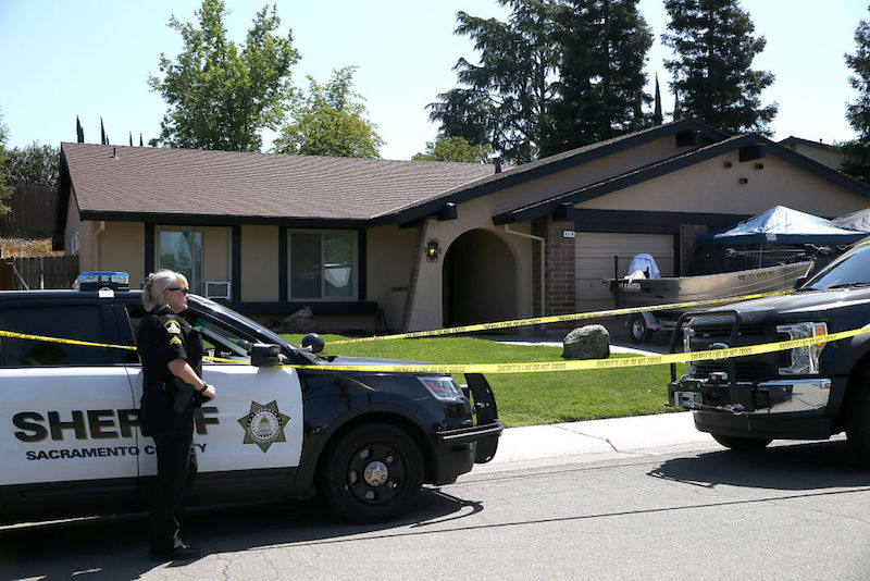 A police woman stands in front of DeAngelo's home. A police woman stands in front of DeAngelo's home.