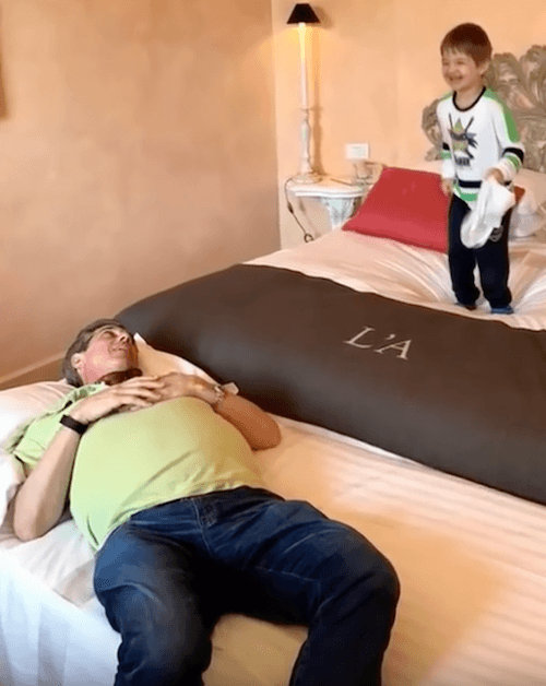 Kevin Daley laying on a bed. Kevin Daley laying on a bed.
