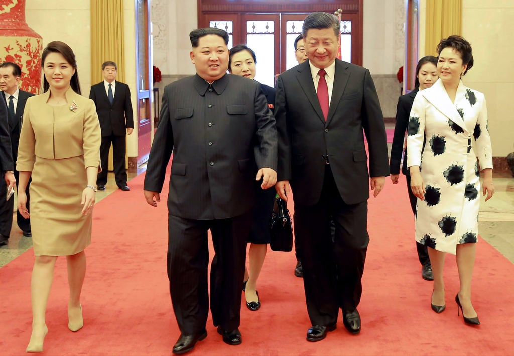 North Korean leader Kim Jong Un and his wife, Ri Sol Ju, with China President Xi Jinping