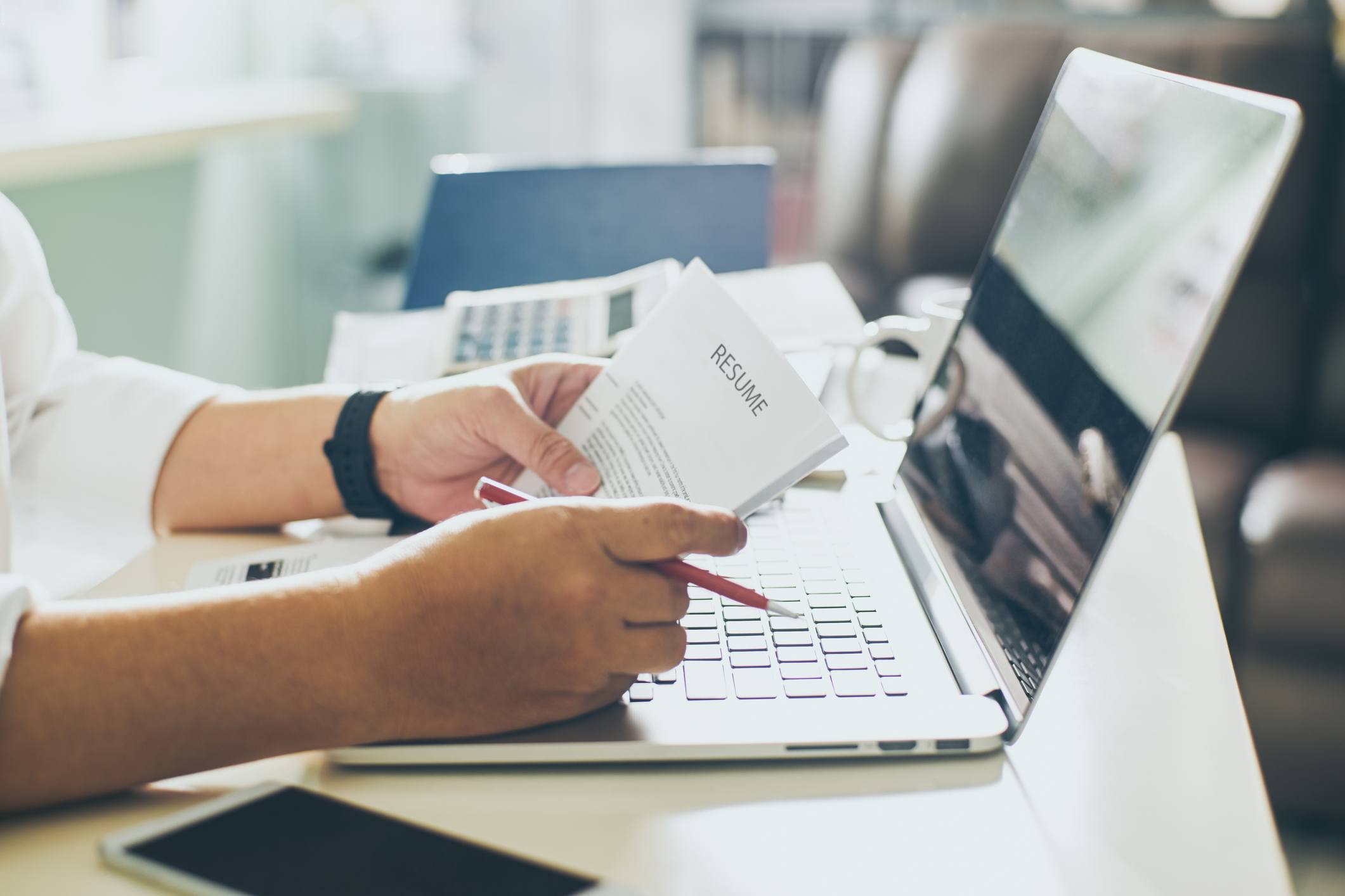 Business man review his resume on his desk