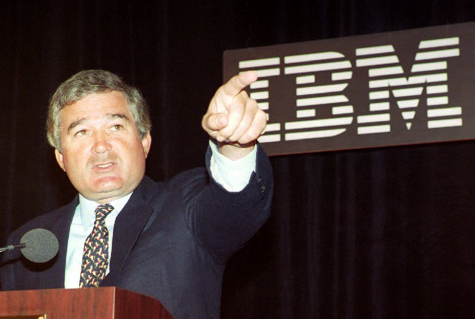 Louis V. Gerstner Jr. answers questions at a news
