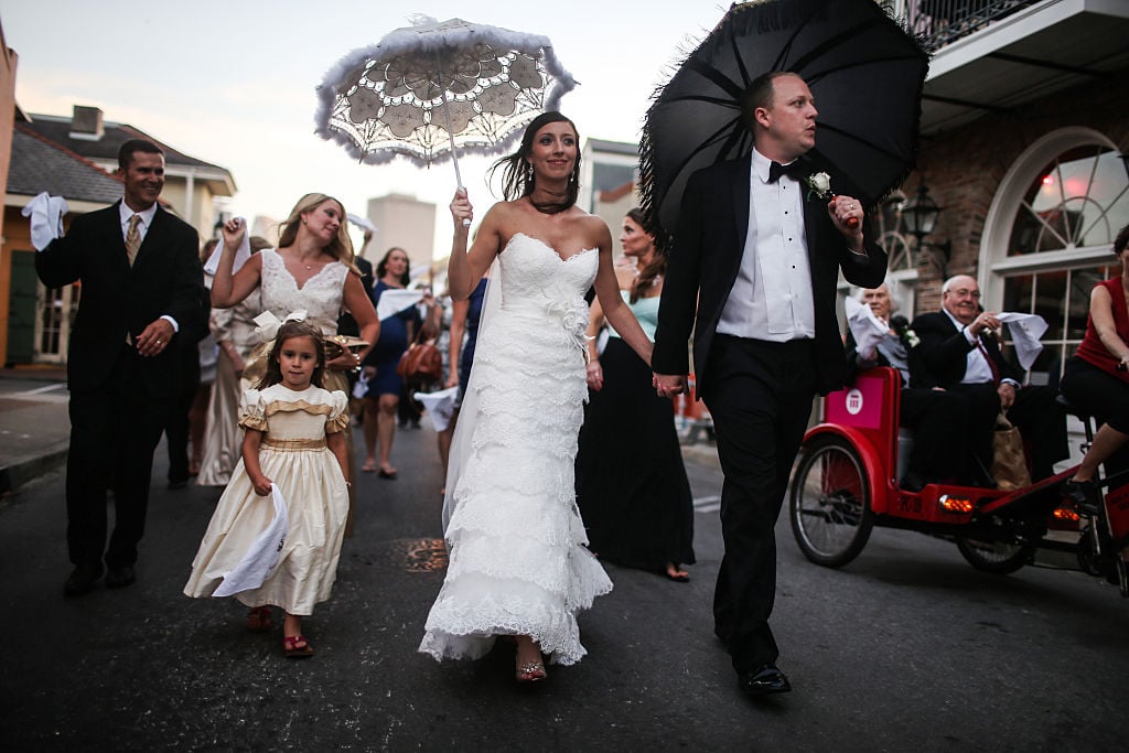 Landrum Hughes and Julie Hughes celebrate their wedding with a 'second line' parade through the French Quarter