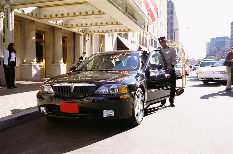 Luxury car and valet attendent
