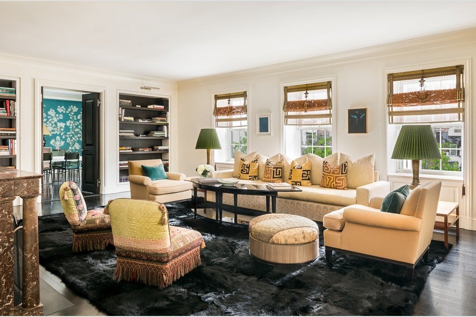 Beige large living room with built in bookshelves
