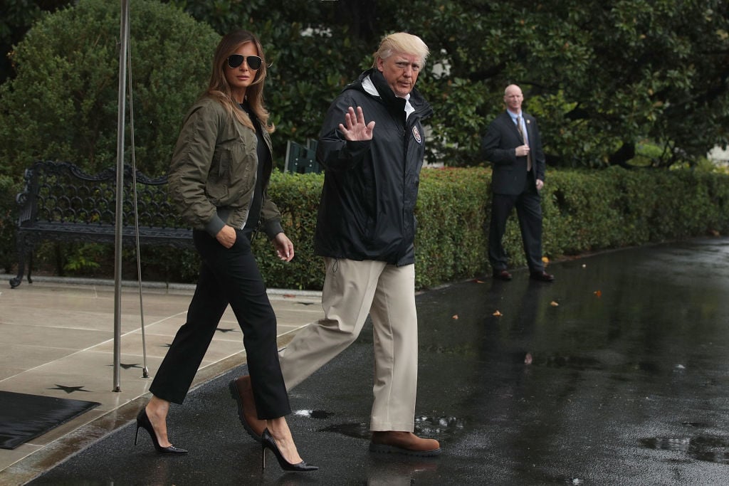 Donald Trump walks with Melania Trump prior to their Marine One departure