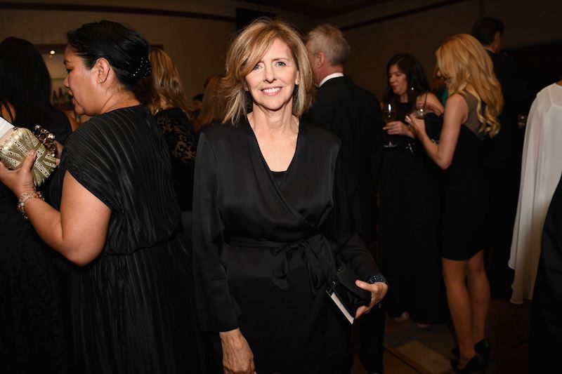 Nancy Meyers poses in a black dress at a party. Nancy Meyers poses in a black dress at a party.