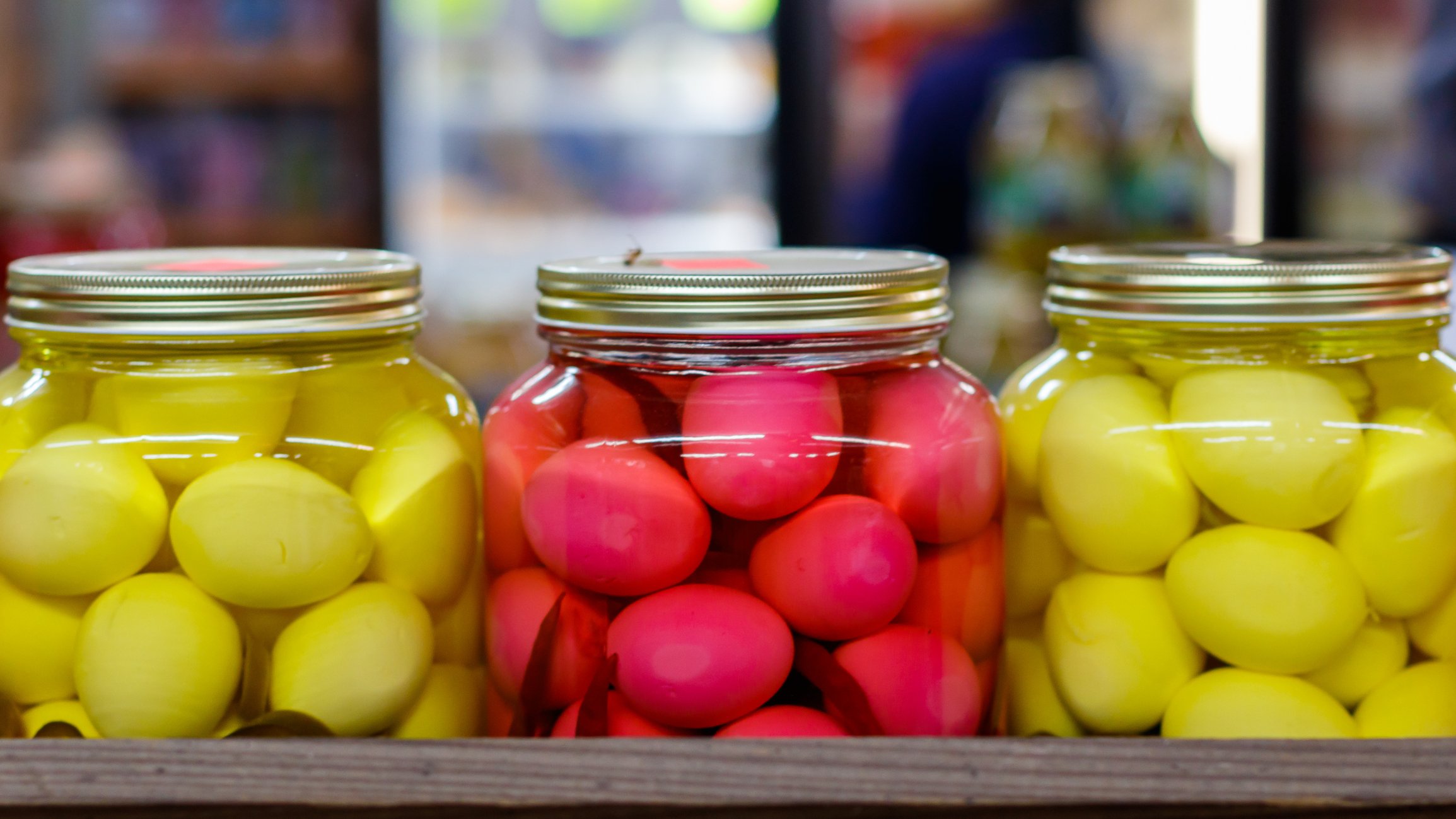 Yellow and Red Picked Eggs at a Produce Stand.