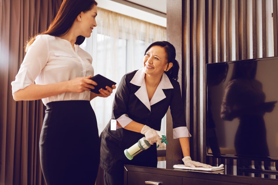 Attendant talking with room guest