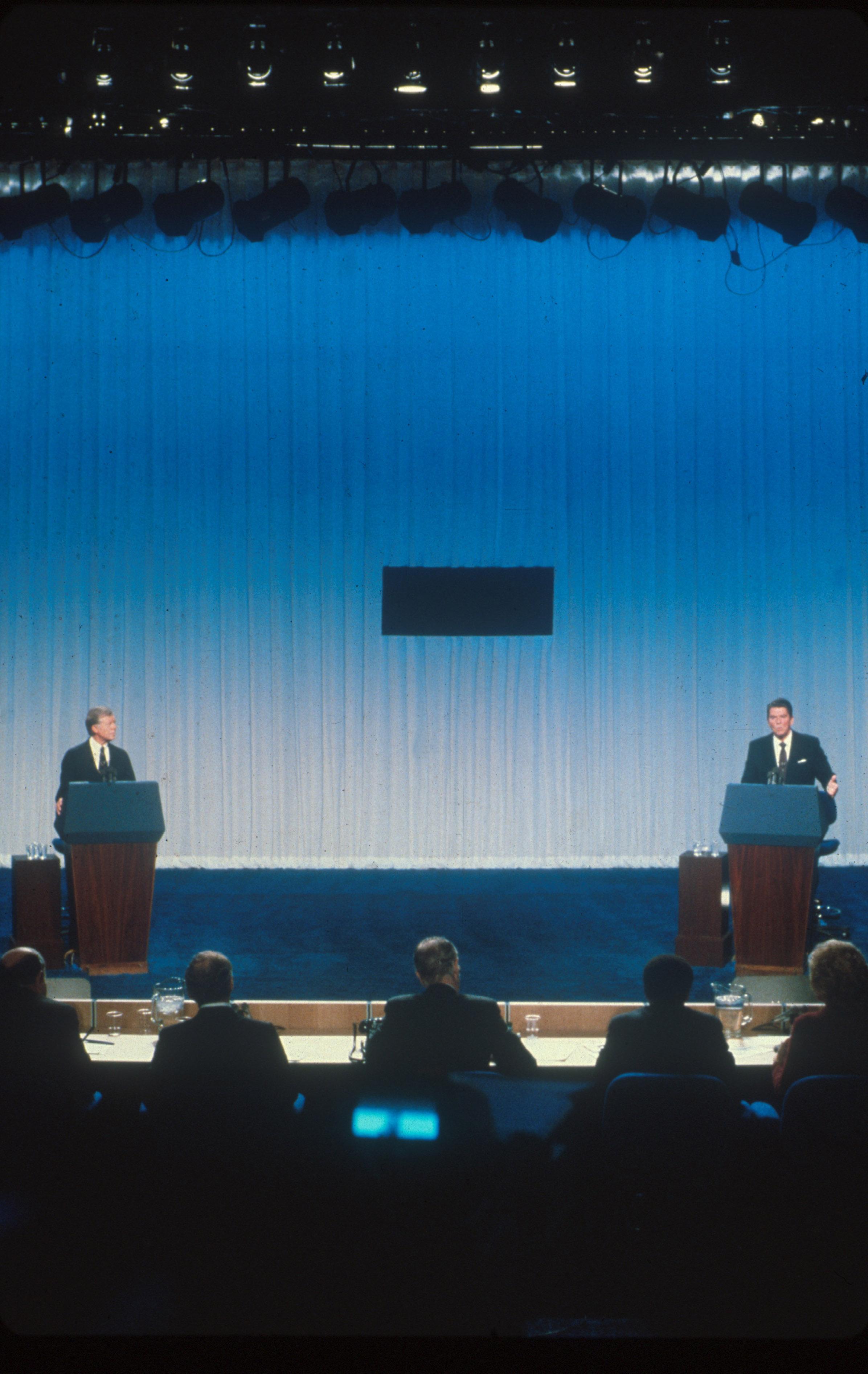 immy Carter and Ronald Reagan debate each other