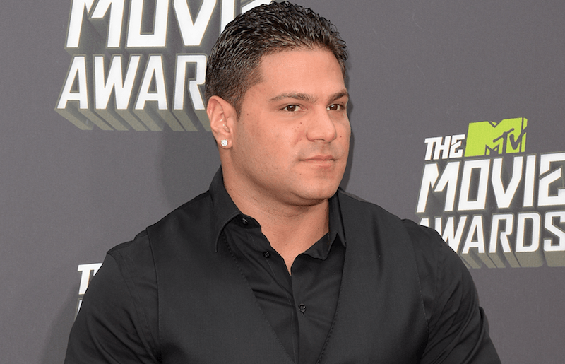 Ronnie Ortiz-Magro posing on a red carpet. Ronnie Ortiz-Magro posing on a red carpet.