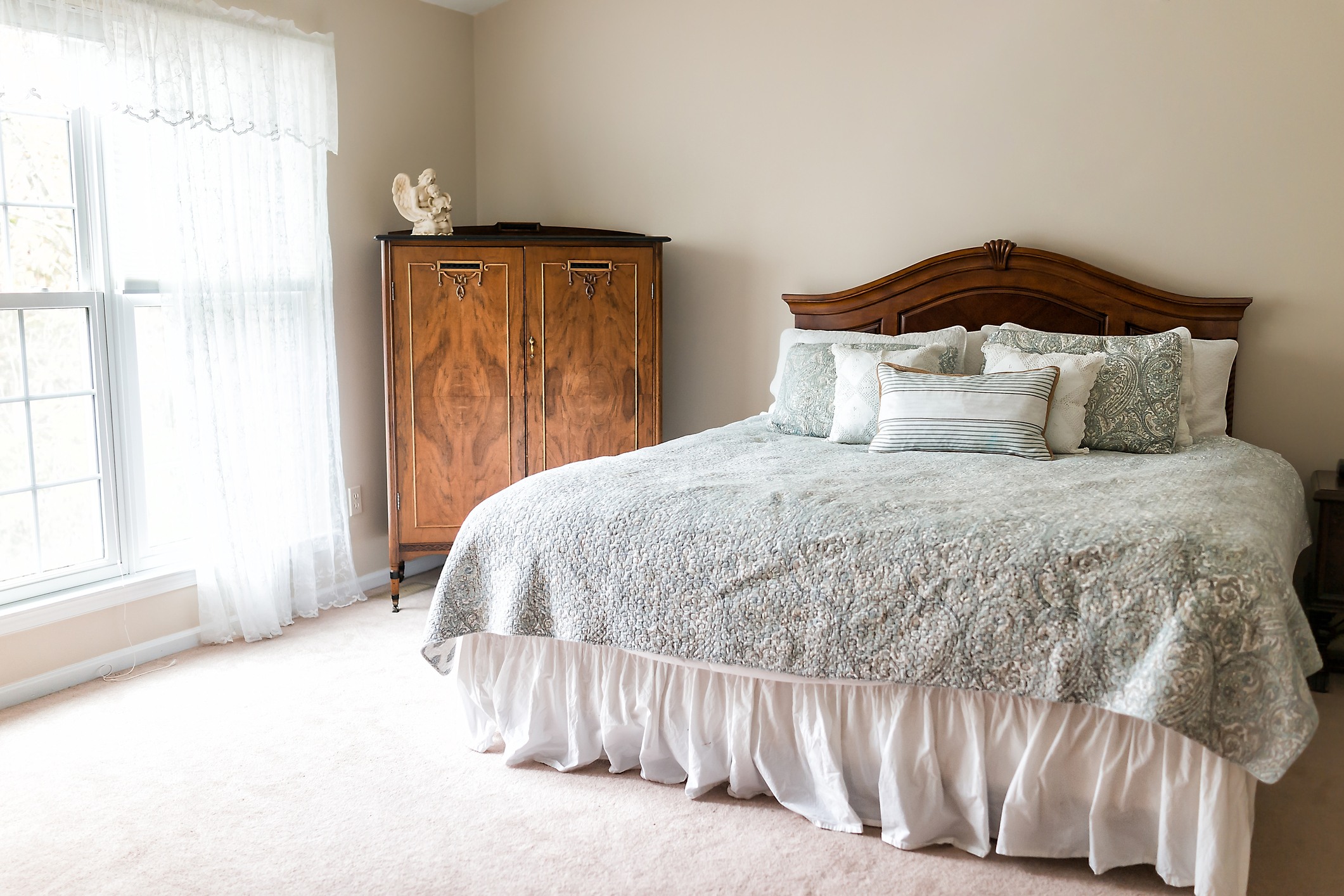 Dated bedroom with ruffle bed skirt