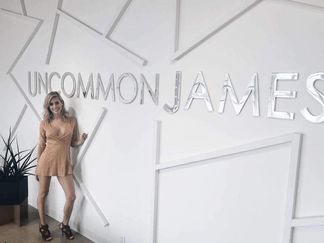 Kristin Cavallari in front of an Uncommon James sign Kristin Cavallari in front of an Uncommon James sign